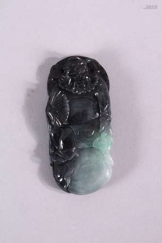 A CHINESE CARVED GREY JADEITE PENDANT, carved as a male figu...