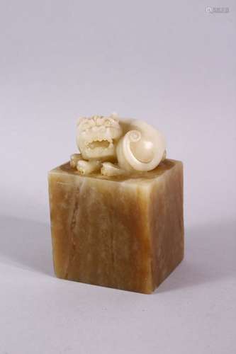 A GOOD CHINESE SOAPSTONE CARVING in the form of a dog of fo,...