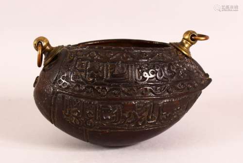 A SMALL ISLAMIC CARVED COCO KASHKOOL, the sides carved with ...