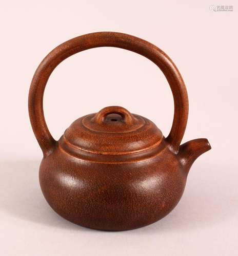 A CHINESE YIXING CLAY TEAPOT, with a fixed moulded handle, t...