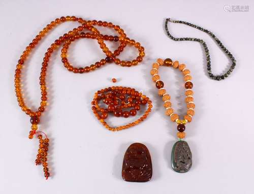 A BOX OF MIXED CHINESE BEADS AND TWO PENDANTS.