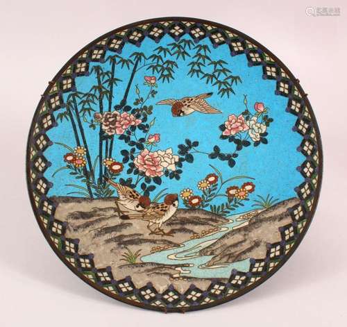 A CLOISONNE CIRCULAR DISH, depicting birds and flowers by a ...