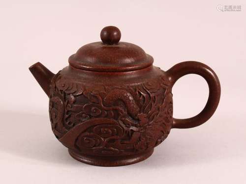 A CHINESE YIXING CLAY DRAGON TEAPOT, with heavily moulded dr...