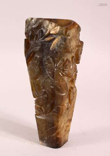 A CHINESE CARVED JADE VASE, carved with figures and foliage,...