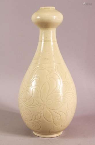 A CHINESE SONG / DING STYLE CARVED PORCELAIN VASE, with scra...