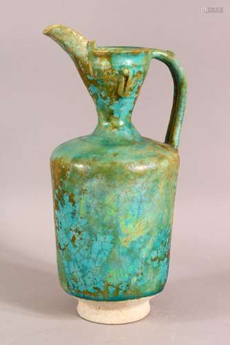 A KASHAN TURQUOISE GLAZED POTTERY EWER, 27cm high.