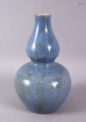 A CHINESE MONOCHROME PALE BLUE GLAZED PORCELAIN GOURD VASE, ...