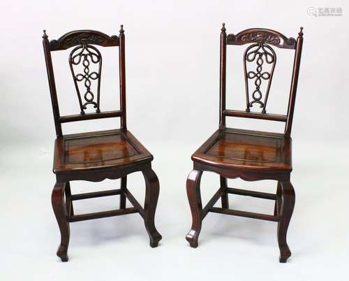 A GOOD PAIR OF CHINESE ROSEWOOD SIDE CHAIRS, the cresting ra...