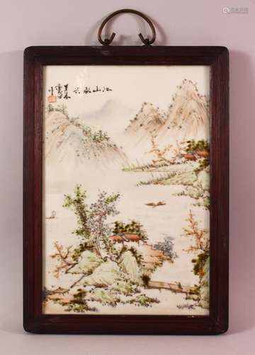 A CHINESE FAMILLE ROSE PORCELAIN FRAMED PANEL - depicting a ...