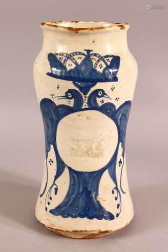 A GLAZED POTTERY BLUE AND WHITE MEDICINE JAR, the body decor...