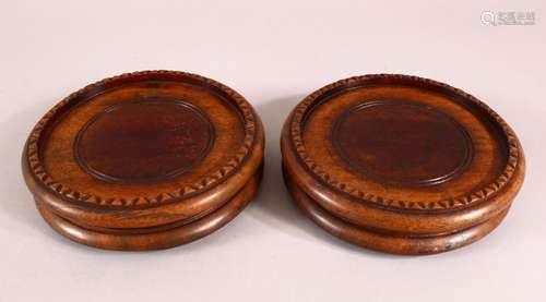 A PAIR OF 19TH CENTURY CHINESE CARVED HARDWOOD STANDS, housi...