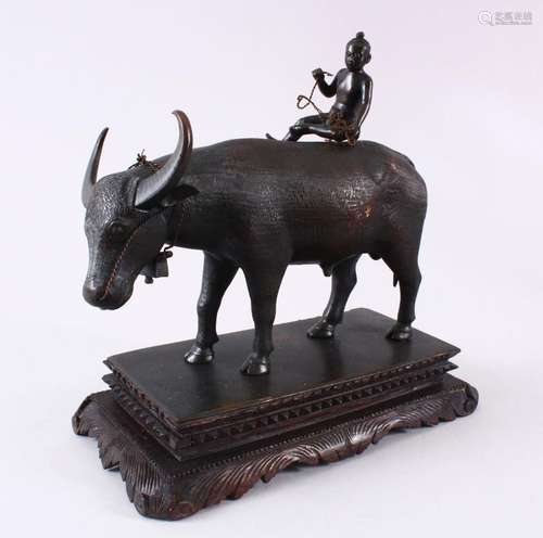 AN INDIAN JAIPUR SCHOOL BRONZE MODEL OF A COW, with a boy se...