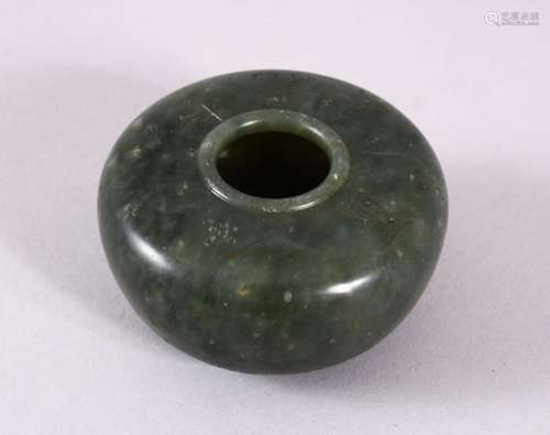 A CHINESE CARVED MOSS GREEN JADE INSCRIBED BUSH WASH, with f...