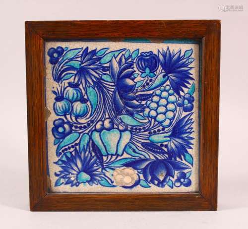 A TURKISH TURQUOISE GROUND FLORAL TILE SECTION, framed, 23cm