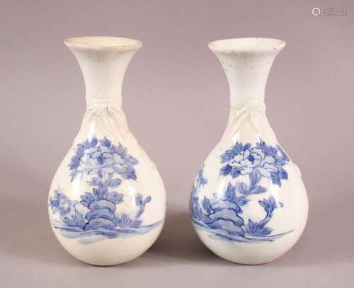 A PAIR OF JAPANESE HIRADO BLUE AND WHITE BOTTLE VASES, with ...