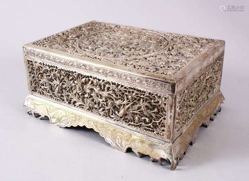 A 19TH CENTURY INDIAN OPENWORK WHITE METAL LIDDED BOX, decor...