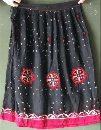 AN INDIAN BLACK SILK SKIRT AND SHAWL SET, each with embroide...