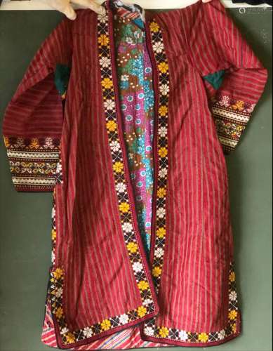 A LONG EMBROIDERED TEKKE COAT, 20th Century, with floral lin...