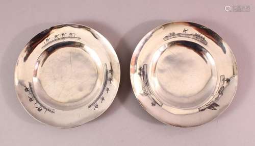 TWO IRAQI SILVER AND NIELLO DECORATED CIRCULAR DISHES, the b...