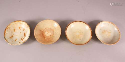 FOUR EARLY CHINESE POTTERY BOWLS, of varying style and size ...