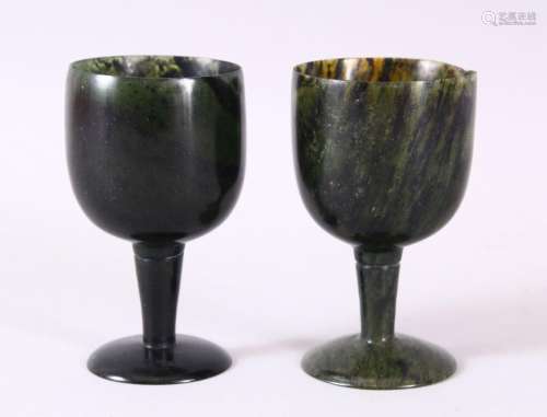 A GOOD PAIR OF MUGHAL CARVED SPINACH GREEN JADE GOBLETS, 10c...