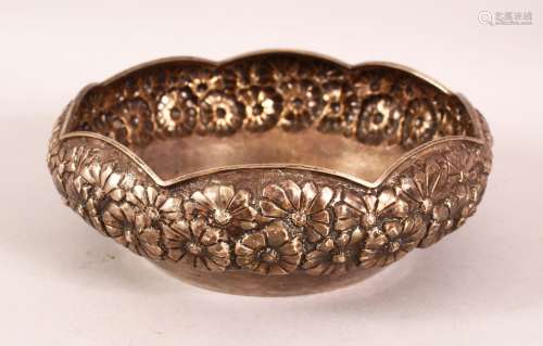 AN INDIAN SILVER BOWL, with embossed and chased floral decor...