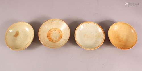 FOUR EARLY CHINESE POTTERY BOWLS, of varying style and size ...