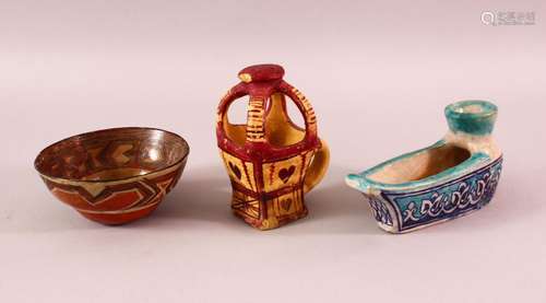 THREE NORTH AFRICAN POTTERY ITEMS, including a circular bowl...