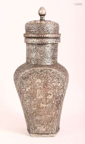 A GOOD PERSIAN TINNED COPPER LIDDED URN - the body carved wi...