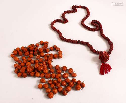 TWO CARVED TIBETAN SEED / NUT ROSARY BEAD NECKLACES, The lar...