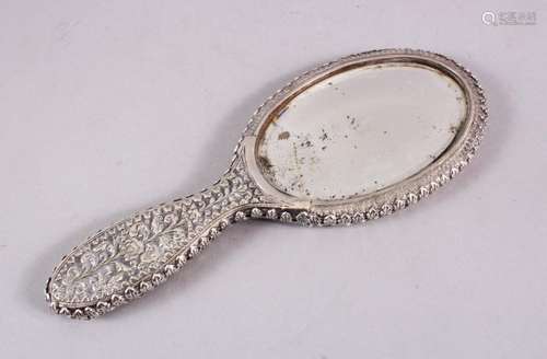 A 19TH CENTURY INDIAN SILVER HAND MIRROR, with embossed deco...