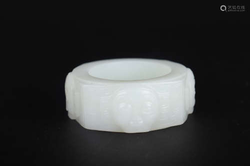 A CARVED WHITE JADE ANNULAR ORNAMENT