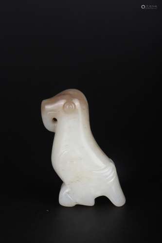 A CARVED WHITE AND RUSSET JADE FIGURE OF BIRD