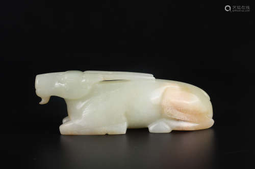 A CARVED PALE GREENISH JADE FIGURE OF BEAST