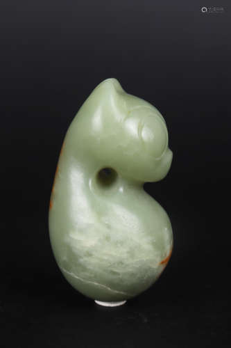 A CARVED CELADON JADE FIGURE OF BEAST