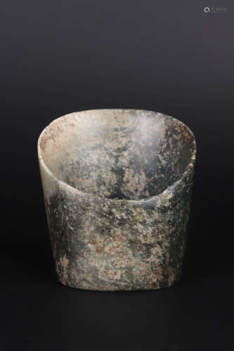 A CARVED BROWNISH JADE CUP