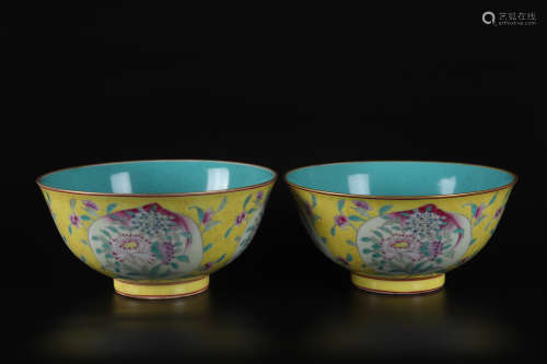 A PAIR OF YELLOW GROUND FAMILLE ROSE FLOWER AND FU&SHOU BOWL...