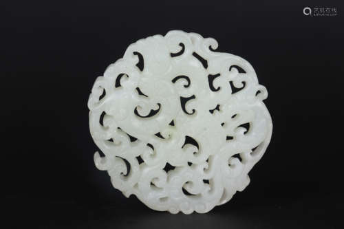 AN OPENWORK HETIAN JADE DRAGON AND PHOENIX ORNAMENT