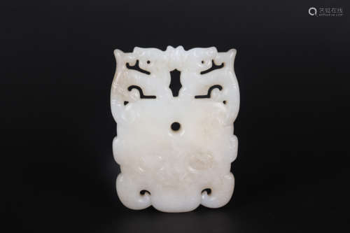 A CARVED HETIAN JADE ORNAMENT