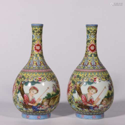 A PAIR OF YELLOW GROUND WESTERN FIGURE BOTTLE VASES