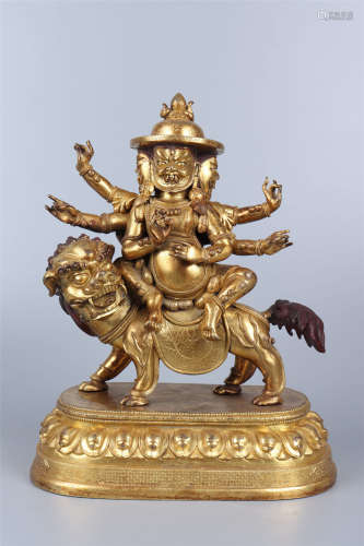 A GILT BRONZE STATUE OF JAMBHALA