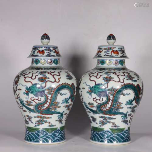 A PAIR OF DOUCAI DRAGON AND CLOUDS GINGER JARS AND COVERS