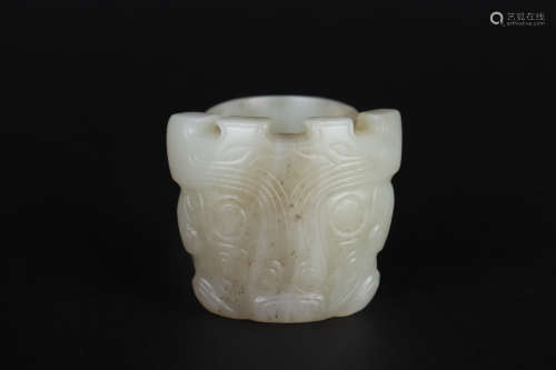 A CARVED JADE FACE THUMB RING