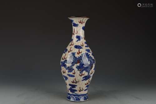 AN UNDERGLAZE BLUE AND COPPER RED GLAZE DRAGON AND PHOENIX V...