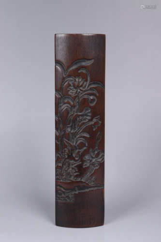 A CARVED HARDWOOD FLOWER ARM REST