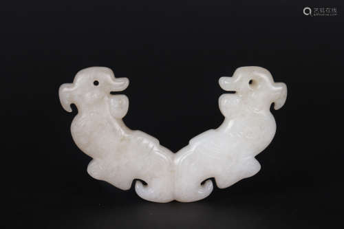 A CARVED HETIAN JADE ORNAMENT