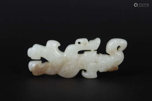 A CARVED WHITE AND RUSSET JADE ORNAMENT