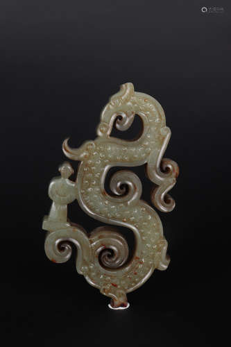 A CARVED GREENISH AND RUSSET JADE DRAGON AND FIGURE ORNAMENT