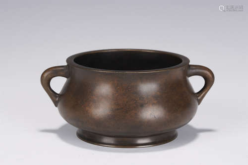 A BRONZE CENSER WITH DOUBLE HANDLES