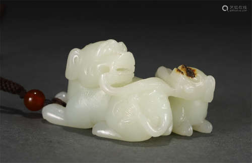 A CARVED WHITE JADE BEAST GROUP